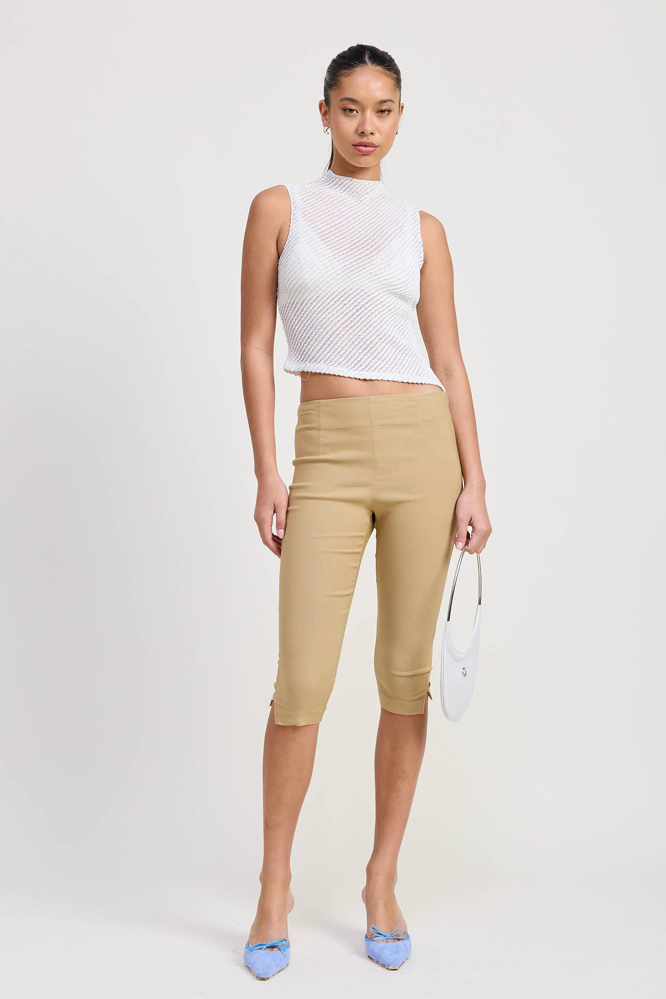 SLEEVELESS ASYMMETRICAL HIGH NECK TOP